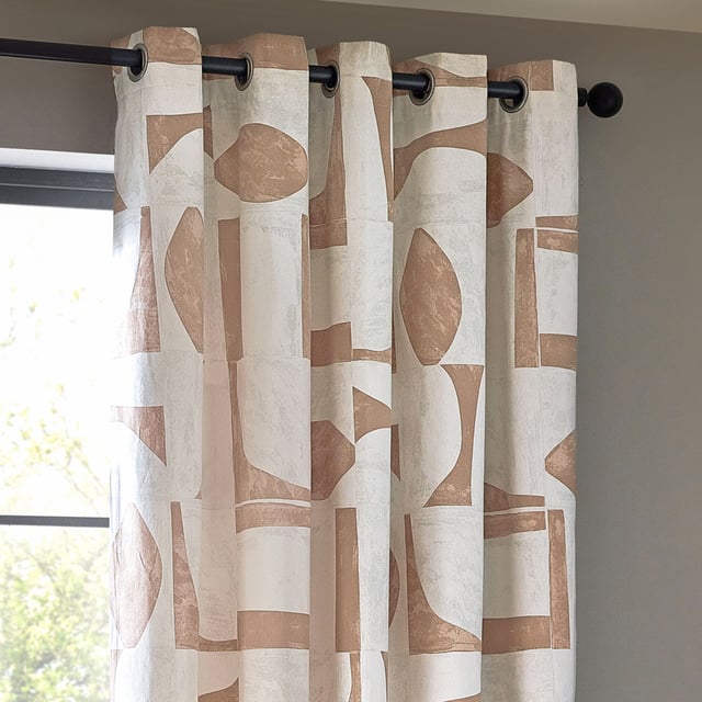 Blending modern neutrals with nature-inspired tones to create an inspiring collection of prints that stand the test of time. Create impact with simple but stylish prints. Carro is a new modern classic. Featuring a unique geometric design inspired by minimalist and abstract art, these printed eyelet curtains are woven using 100% cotton half-panama fabrics and are complete with room-darkening qualities, making them suitable for every type of home.