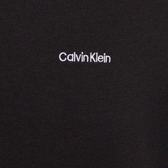 Mens Calvin Klein Lounge Sweatshirt in black.- Ribbed crewneck.- Ribbed cuffs and hem.- Signature tape inside the neckline.- Calvin Klein embroidery on the chest.- Regular fit.- Ref: 000NM2300EUB1