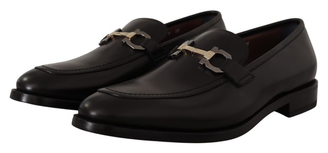 Brand new with tags and dust bag
  100% authentic Salvatore Ferragamo mens shoes
  Model: Lewis
  Color: Black
  Material: 100% Calf Leather
  Formal version of the gentlemens loafer
  Calf leather tumbled and hand buffed for depth of color
  Gancio bit in cool palladium finish
  Open grooves reveal stitching on leather sole
  Made according to Originali construction method
  Made in Italy
Material: Calf Leather
