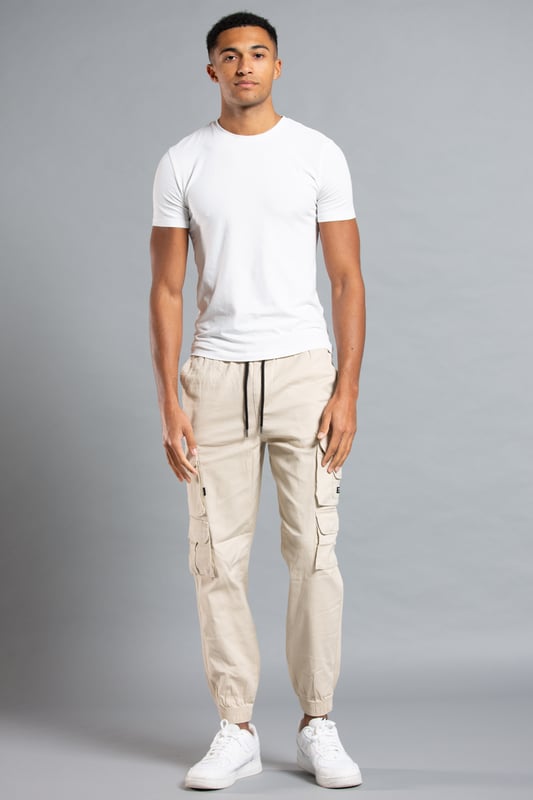 These cargo-style trousers from Tokyo Laundry are wardrobe staples. Made from soft cotton fabric, these trousers are perfect for everyday wear. Featuring two side pockets, four cargo-style pockets and two back pockets, a drawstring with toggle, elasticated waistband and cuffs and Tokyo Laundry branding on the front. Machine washable for easy care.