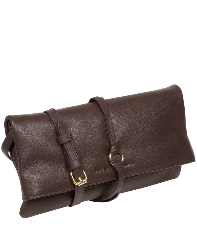 The 'Selene' cross body clutch bag from the Pure Luxuries Marylebone Collection is handcrafted from high-quality, genuine Nappa leather with a natural super-soft touch. The fold-over top secured by two magnetic press studs, opens to reveal a zipped main compartment and a slip pocket. The interior is lined with 100% cotton and includes two slip pockets to help maintain an organised bag. Comes with a matching and adjustable slim leather strap, with a maximum drop length of 65cm. The strap is also removable, transforming the bag into a clutch bag. Features gold-coloured metal fittings and zip. The Pure Luxuries logo is embossed for an effortless and sophisticated finishing touch.