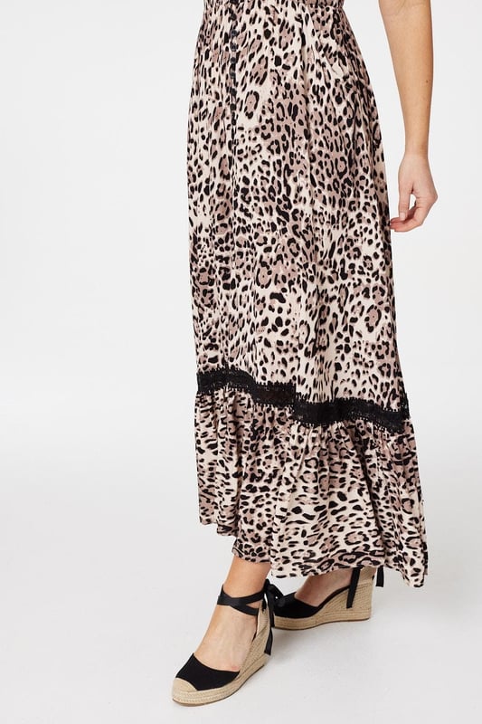 Make a statement in this animal print maxi dress. It has a V-neck with a button front and lace shoulder detail, a shirred waist, frilled cap sleeves and a tiered maxi skirt with a lace trim. Made from 100% breathable viscose to keep you cool and comfortable. Team with heeled wedges for a striking holiday style that's perfect for alfresco evening drinks.