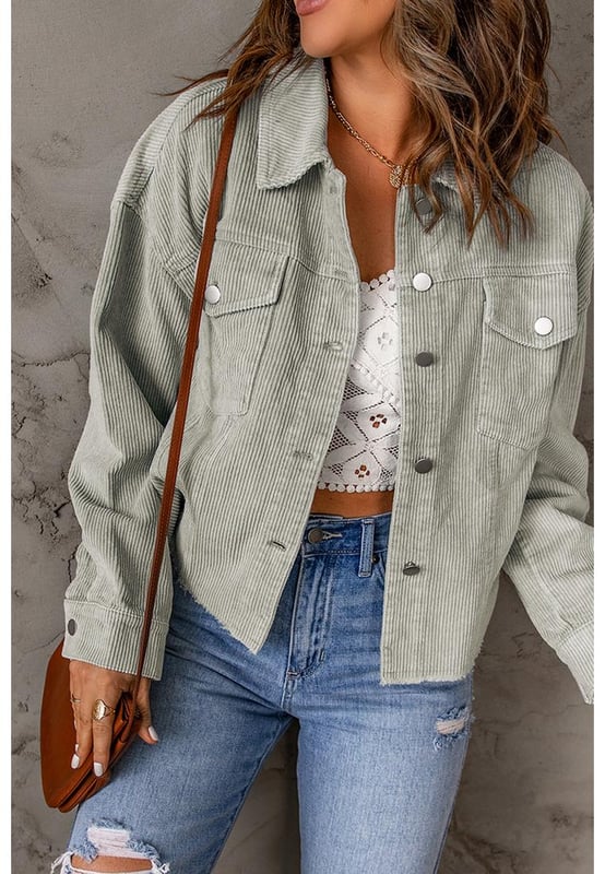 Made from Quality corduroy fabric
  Raw hem design for an edgy look
  Features flap pockets for functional storage
  Cropped length for versatile styling
  Perfect for layering over dresses or pairing with high-waisted jeans
  Available in multiple sizes
Material: 100% Cotton