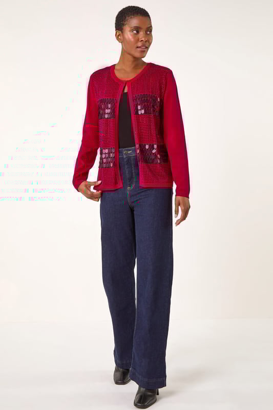 Sequin Embellished Knit Cardigan from Roman. Add a touch of sparkle to your Autumn Winter look with this luxurious sequin embellished knit cardigan. Designed with intricate sparkly details, this soft, knitted long-sleeve cardigan is perfect for any smart or casual event. With a unique front fastening detail and a round neckline featuring hook and bar features, this cardigan is a classic addition to your outfit. Simply style with wide-leg trousers and ankle boots!
