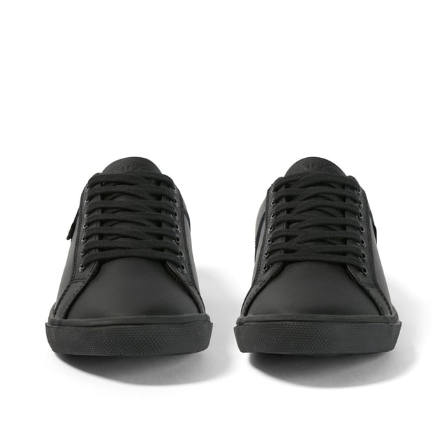 Kickers Kody Low Profile Trainers Junior - Perfect for school, these low profile trainers have been crafted with a durable construction to the upper boasting a staple black colurway with tone-on-tone stitching for a clean finish. Set upon a black rubber sole, this pair offer a tonal full lace fastening to the upper for a secure fit and are complete with the Kickers logo tag adorned to the lateral sides and heel counter.