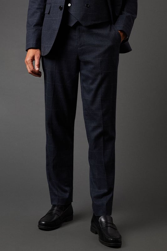 Tailored fit trousers for a refined silhouette
        Distinctive pow check pattern adds visual interest
        Side pockets for practicality
        Belt loops for versatile styling options
        Tapered leg design for a modern look
    
    These Burton pow check trousers offer a sophisticated twist on classic tailoring. The tailored fit sculpts your silhouette while providing comfort and ease of movement. Perfect for the discerning gentleman who appreciates timeless style with a contemporary edge. Pair with the matching jacket and waistcoat for a complete suit that commands attention at formal events or important business meetings. For a smart-casual ensemble, team with a crisp white shirt and leather brogues. The versatile design allows for effortless transition from day to night, making these trousers an essential addition to any well-curated wardrobe. Whether you're heading to the office, attending a wedding, or enjoying a night out at your local pub, these trousers will ensure you look polished and put-together.