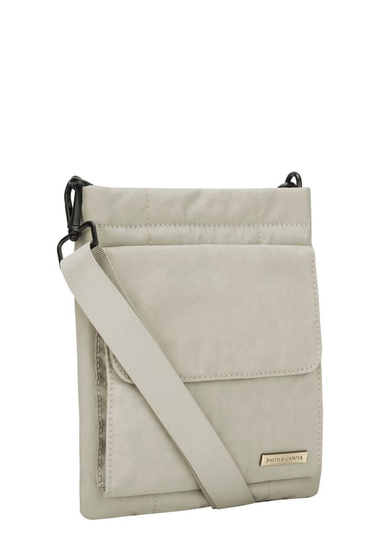The perfect daily companion for carrying all your essentials. The Portrait Nylon Crossbody Bag features two internal main compartments, a flap over zip pocket to the front and fully adjustable strap with a clip off function. Features: , Zip top opening, Front flap over zip pocket, Rear zip pocket, SMITH & CANOVA antique brass logo, Branded antique brass zips, Adjustable crossbody strap (detachable), Two internal main compartments, Internal zip pocket Style Ref: 92685 STONE