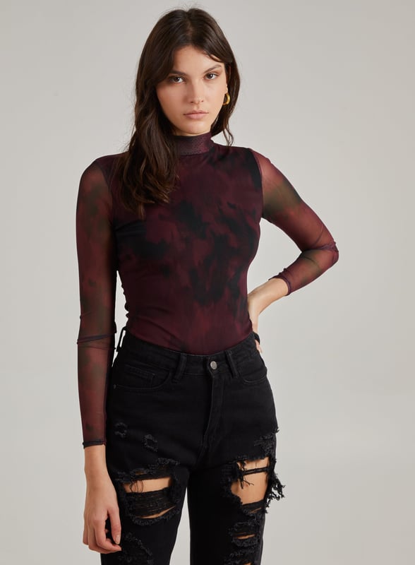 This Smudge Print Bodysuit is all you need to make a statement. Pair with knee high boots and distressed jeans for a killer look.
