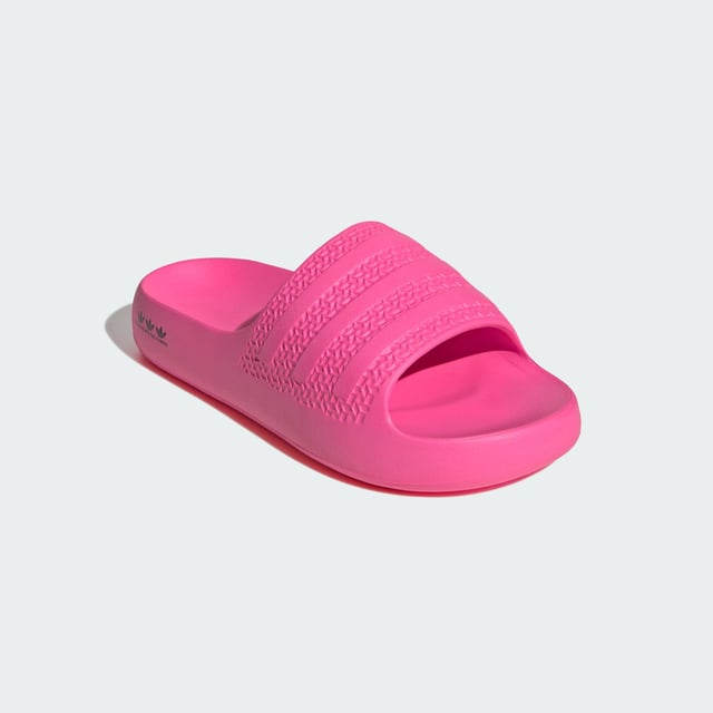 The moment you step into these adidas Adilette Ayoon Slides, you're at ease. That's the whole point of them. They let you bring the comfort of home with you anywhere, thanks to the super soft one-piece EVA foam build. That minimalist approach extends beyond the construction — the colours also keep things toned down, which happens to mean that they also style well with everything.  - Slip-on - EVA upper - Ultra-soft feel - EVA outsole  Shipped by adidas