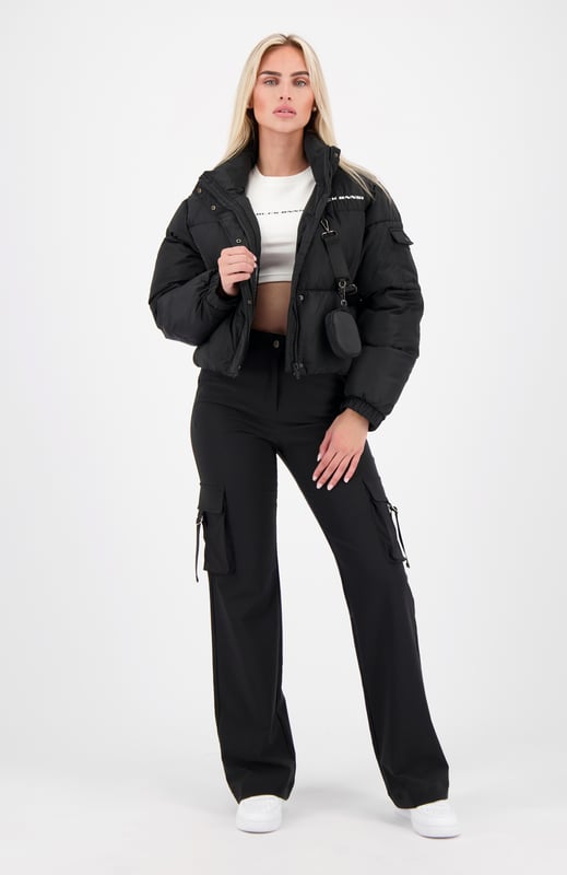 100% Polyester Short fit High collar with zipper and button closure BLCK BNNS logo on left chest Two front pockets Adjustable cuffs Side pocket on left arm Detachable zipper pouch 