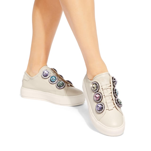 This Kurt Geiger Laney Octavia sneaker features a bone leather upper with six large pastel crystals along the eye stay. The tongue and heel features silver foil branding. Sole height: 4cm.