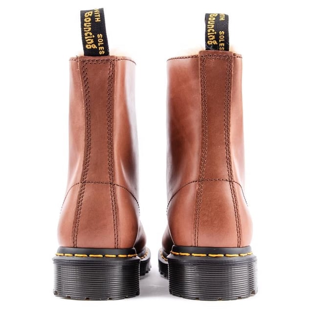 The Women's Brown Dr. Martens 1460 Serena Ankle Boots Bring It To The Point - Timeless, Stylish, Alternative, With A Premium Leather Upper, A Warm Faux Fur Lining And Sock, The Iconic Yellow Stitching And The Famous Air-cushioned Airwair Sole, Which Gives Them The Real Doc Martens Edge. Featuring Goodyear Welt And A Rugged Treat For Enhanced Durability And Sturdiness. These Boots Definitely Stand Out From The Crowd.