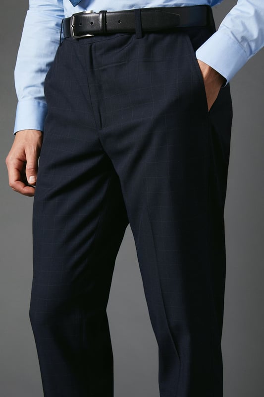 Slim fit design for a modern, tailored silhouette
        Distinctive windowpane check pattern adds visual interest
        Belt loops for versatile styling options
        Tapered leg for a sleek, contemporary look
        Suitable for smart casual to formal occasions
    
    These Burton slim fit trousers present a sophisticated option for the discerning gentleman. The windowpane check pattern introduces a subtle yet stylish element, perfect for those who appreciate classic designs with a contemporary twist. Ideal for smart casual events or more formal occasions, these trousers offer versatility in your wardrobe. Style them with a crisp button-down shirt and polished brogues for a refined office look, or pair with a lightweight jumper and smart trainers for a more relaxed weekend ensemble. The slim fit and tapered leg create a streamlined silhouette that's both flattering and on-trend, making these trousers a go-to choice for the modern man who values both style and comfort in his attire.