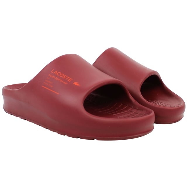 The Lacoste Serve Slide 2.0 223 2 CMA Men's Red Sliders deliver bold style and everyday comfort, making them an essential choice for casual wear, poolside relaxation, or beach outings. With their vibrant design and premium construction, these sliders offer practicality and flair.
Â 
Key Features:
Ergonomic Footbed: 

Contoured for superior comfort and support, providing a comfortable fit for extended wear.


Durable Synthetic Strap: 

Features the iconic Lacoste crocodile logo embossed for a sporty and stylish look.


Slip-On Design: 

Ensures easy on-and-off wear, making them perfect for leisure and quick outings.


Textured Rubber Outsole: 

Offers reliable grip and traction on various surfaces, even in wet conditions.


Lightweight Construction: 

Reduces fatigue, ensuring comfort for all-day use.


Water-Resistant Materials:

Designed to withstand exposure to water, making them ideal for pool or beach environments.


Bold Red Colorway: 

A striking and energetic design that adds a vibrant touch to your casual wardrobe.


Â 
The Lacoste Serve Slide 2.0 223 2 CMA Men's Red Sliders combine comfort, durability, and a bold aesthetic, making them a go-to option for relaxed and stylish footwear. Perfect for vacations, lounging, or adding a pop of color to your everyday look.
Â 
Â 
Â 
