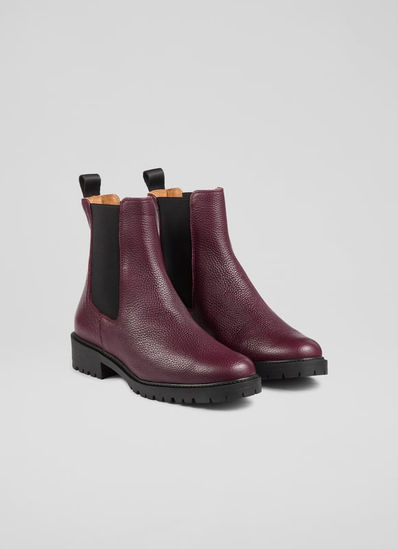 Make a bold statement with these Cadea ankle boots, perfect for casual wear. Crafted in Spain from luxurious textured leather, the tread sole boot features a round toe and a flat tread sole for ultimate comfort. These boots pair effortlessly with skinny jeans or a flowing midi dress for a stylish, versatile look.
