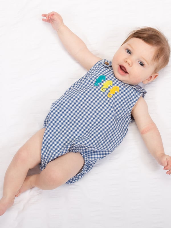 Seahorse pairs are friends for life, and you can even spot them around the British coastline! This stylish bubble-shaped romper, with cute seahorse embroidery detail, is designed using lightweight yarn dyed check fabric to keep your little one cool in the summer sun. It's comfy, breathable and looks great too.
