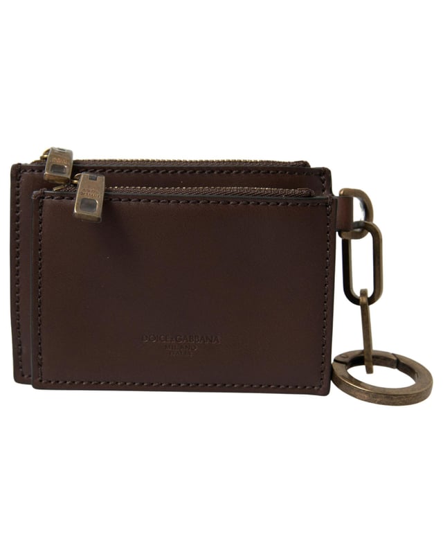 100% läder\n  Dragkedjeförslutning\n  Nyckelring ingår\n  Dolce \u0026 Gabbana-logotypdetaljer\n  Tillverkad i Italien\n  Mått: 11 cm x 8 cm x 2 cm\nMaterial: 100% läder