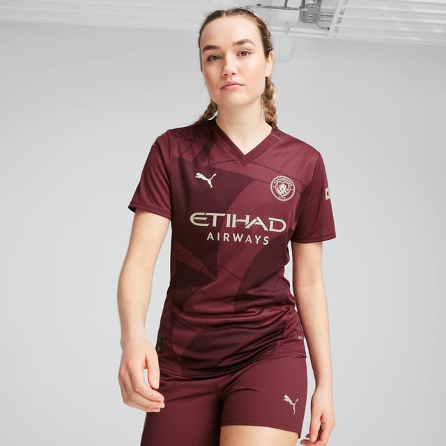 PRODUCT STORY: City represents constant movement, on and off the pitch. With the 2024/25 Third Kit, we pay tribute to a club symbol thats been there through it all, across three stadiums, many generations, and countless moments that gave new meaning and importance to the game. The ship from the Man City?crest?is transformed into an all-over graphic that represents the past, present, and future of a club thats never not moving. FEATURES & BENEFITS: dryCELL: Performance technology designed to wick moisture from the body and keep you free of sweat during exercise; As part of the RE:FIBRE program, this garment is made of at least 95% recycled material from textile waste and other used materials. DETAILS: Regular fit; 170 gsm, Jacquard; V-neck; Short sleeves; Official team branding. Our model is 175 cm tall and is wearing size S UK.
