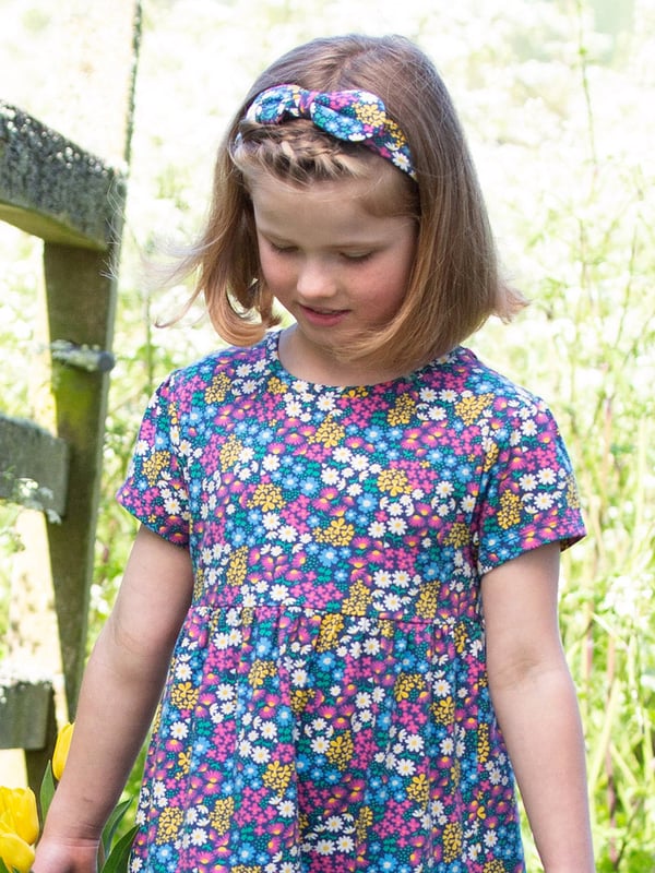 95% organic cotton 5% elastane | Proud to be certified to the Global Organic Textile Standard (GOTS) | Flower patch all-over print | Single jersey with a little bit of stretch (180-190 gsm) | Bow detail | Made in Turkey | Machine washable at 40 degrees, or at 30 degrees to be kinder to the planet