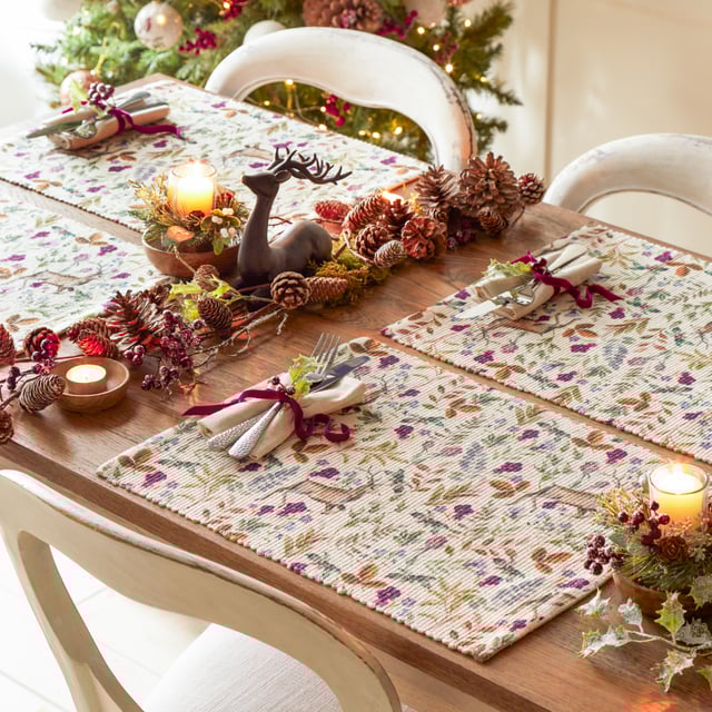 A wonderfully festive set of four placemats which features charming Reindeers who stand proudly amongst the vivid seasonal florals. Digitally printed for exceptional clarity on a durable woven polyester fabric, these beautifully designed table placemats will instantly transform your Christmas dining table.
