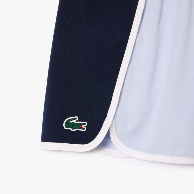 Womens Lacoste Sport Stretch Diamond Taffeta Sport ShortsThese diamond taffeta shorts are designed to keep you dry and comfortable during even the most intense training sessions. Made from an ergonomic stretch fabric for freedom of movement  with a key pocket set into the waistband. The contrast trim is a classic Lacoste feature and a nod to court lines.- Diamond taffeta made from recycled polyester - Key pocket in waistband - Ultra-Dry fabric for comfort- Tested by athletes - Silicone crocodile at hem- Main material: 100% Polyester.  Waist: 57% Polyamide  37% Polyester  6% Elastane.  Machine washable.- Ref: GF7373-X1J