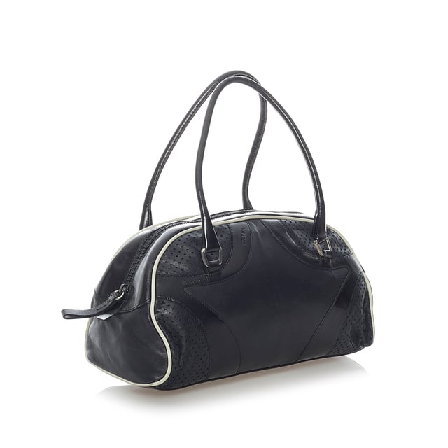 VINTAGE. RRP AS NEW. The Vitello Drive handbag features a perforated leather body, rolled leather handles, a top zip closure, and an interior zip pocket.Exterior back is out of shape and scratched. Exterior bottom is scratched. Exterior corners is scratched. Exterior front is out of shape and scratched. Exterior handle is out of shape and scratched. Exterior side is scratched. Zipper is scratched.

Dimensions:
Length 16cm
Width 28cm
Depth 10cm
Hand Drop 14cm
Shoulder Drop 14cm

Original Accessories: Dust Bag

Color: Black
Material: Leather x Calf
Country of Origin: Italy
Boutique Reference: SSU157102K1342


Product Rating: GoodCondition

Certificate of Authenticity is available upon request with no extra fee required. Please contact our customer service team.