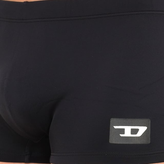 Boxer swimsuit. 
 Color Black 
 Elasticated waistband, adjustable with laces. 
 Brand print on the lower side. 
 Inner lining. 
 Seams in tone. 

 Composition: 
 - 78% Nylon - 22% Elastane. 

 Washing instructions: 
 - Wash at max. 30º. 
 - Do not use bleach. 
 - Allows dry cleaning. 
 - Do not iron. 
 - Do not use dryer. 

 Composition: 78% Nylon, 22% Elastane
 Care:
- Wash at max temperature. 30º.
 - Do not use bleach.
 - Allows dry cleaning.
 - Do not iron.
 - Do not use dryer.