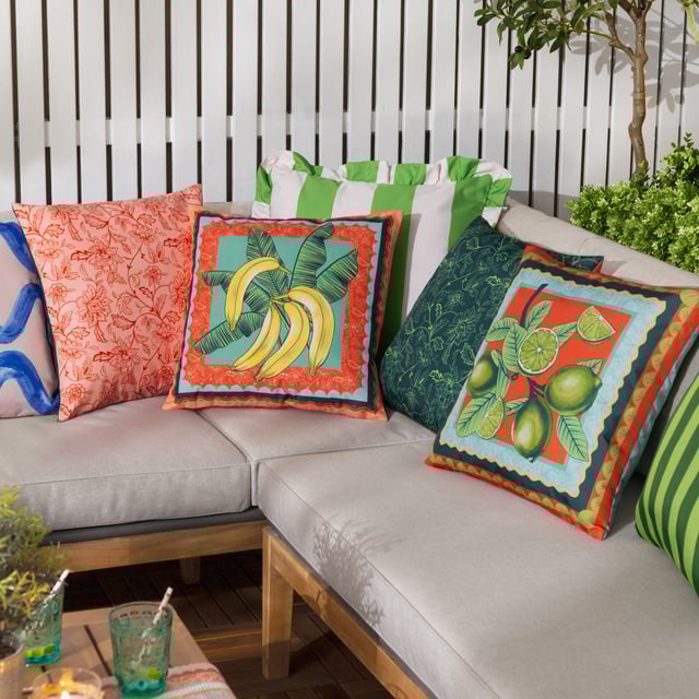 Elevate your outdoor space with the Anemone Bananas Printed Outdoor Cushion, where timeless elegance meets vibrant charm. This water-resistant cushion is crafted for year-round use and boasts a unique fusion of fruity motifs and heritage-inspired patterns. The striking combination of playful banana illustrations with a floral Jacobean print, finished with a scalloped border, offers a sophisticated twist on classic 17th-century textiles. Designed to impress, it delivers a fresh, modern aesthetic that invites personality and flair into any setting—perfect for those who take pride in creating a home that feels uniquely theirs.