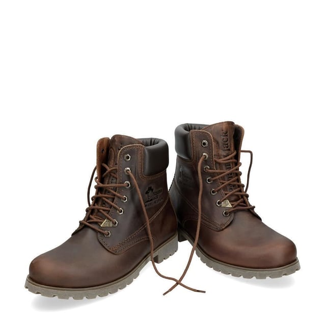 Step Out in Style and Comfort with Panama Jack Boots Whether you're trekking through rugged countryside trails or navigating urban streets, the original Panama Jack 03 C8 Mens Lace Up Boot is your perfect companion. Boasting a classic design with a plain round toe and a brown padded leather collar, these boots exude timeless elegance. The stitched commando sole ensures durability and stability on any terrain. For the gentlemen, the Men's Brown Panama Jack 03 Lace-up Ankle Boots are designed to withstand the elements. Featuring a waterproof smooth nubuck upper, soft padded ankle shaft, and warm lining, these boots keep your feet cozy and dry. The embossed logo on the heel and hexagonal metal eyelets add a touch of sophistication to their rugged charm. Key Features: Classic Design: The Panama 03 boots blend design, quality, and comfort seamlessly, offering a timeless aesthetic for both men and women. Versatile Wear: Whether you're exploring the city streets or conquering mountain trails, these boots are perfect for all your daily adventures. Waterproof Construction: Crafted from waterproof vintage nappa leather with leather lining, these boots ensure your feet stay dry and comfortable in any weather. Anatomical Support: Enjoy enhanced comfort and hygiene with the anatomically formed insole that provides a perfect fit for your feet. Durable and Slip-Proof: The rubber outsole offers flexibility, durability, and slip-proof traction, providing stability on various surfaces. Made in Spain: With a shaft height of 18 cm, these boots are expertly crafted in Spain, ensuring superior craftsmanship and quality. Step into Panama Jack boots and experience the perfect blend of style, durability, and comfort for your everyday adventures. Made for those who appreciate quality and craftsmanship, these boots are your trusted companion wherever your journey takes you