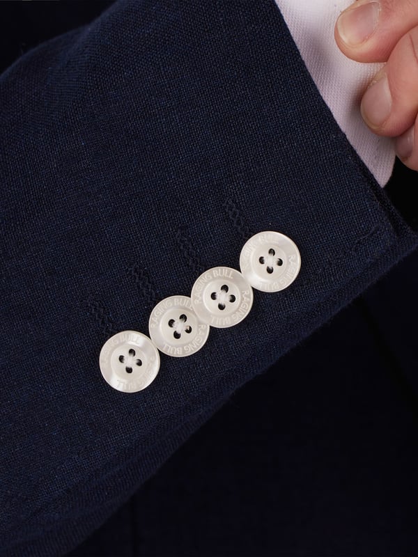 A classic linen blazer to keep you cool when the weather is hot. Brimming with details, including contrasting cuff buttons, complimenting linings and detachable Raging Bull pin badge.  A firm favourite for those smart summer days.