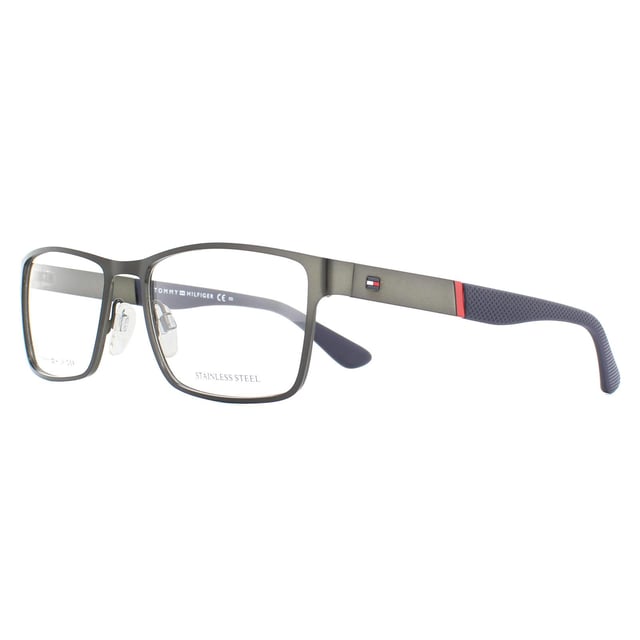 Tommy Hilfiger Glasses Frames TH 1543 R80 Matte Dark Ruthenium are a masculine rectangular design with a flat metal frame front and texture plastic temple tips. Adjustable nose pads guarantee comfort and the Tommy Hilfiger flag logo on the temples ensures brand recognition.