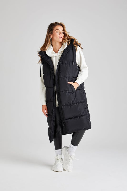 Model is 5'7 and wears a size 8. Regular fit, hooded, shower resistant, zip fastening, padded.