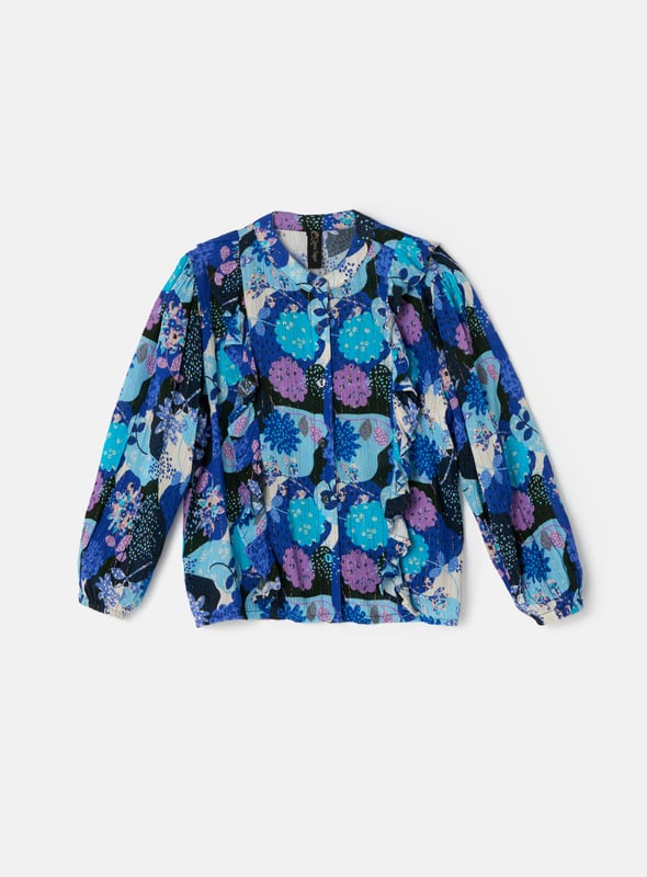 Co-ordinate your style with our scrumptious set. Delicate printed crinkle georgette our pretty blouse looks fabulous paired with her matching skirt but looks equally stunning with denim. About me: 99% Viscose 1% mettalised Fibre Look After Me: Think Planet. Wash At 30C.