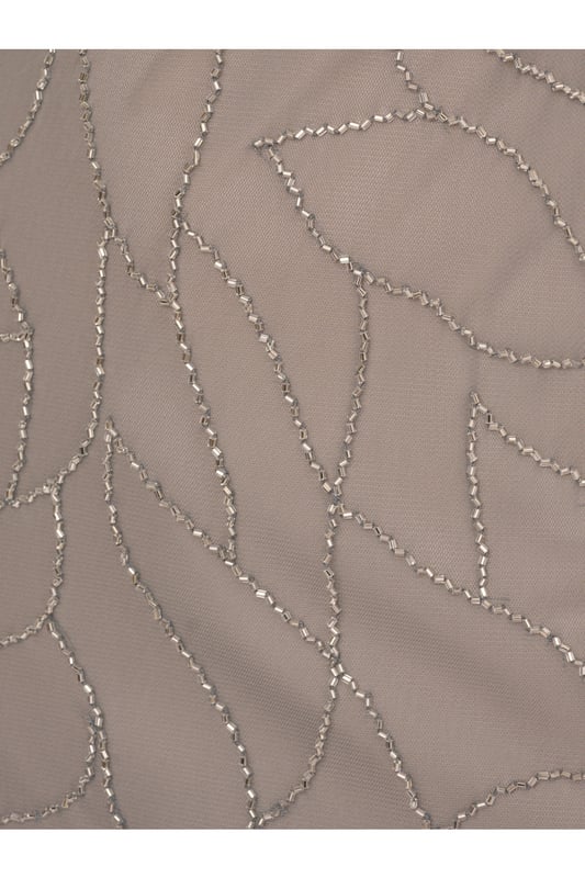 Timelessly sparkle at your next formal event in this blouson gown. This formal dress features a sleeveless blouson bodice, a halter neckline, and a mermaid skirt. Fully lined, this evening gown is designed with mesh knit fabric that is fully embellished with sequin and beaded floral deco patterns. A hidden zipper closure at the centre back completes this sleeveless gown. Paired with nude heels and simple accessories, this beaded dress is ideal for black-tie events or bridal parties.