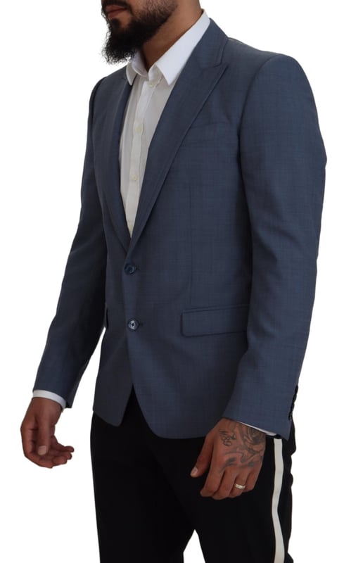 Absolutely stunning 100% Authentic brand new with tags Dolce & Gabbana blazer
  Single breasted style with a blue color and blue inner lining
  Two-button closure
  Logo details
  Made in Italy
  Material: 92% Wool 7% Elastane 1% Polyester
  Lining: 36% Cupro 33% Rayon 31% Acetate
Material: 92% Wool 7% Elastane 1% Polyester
