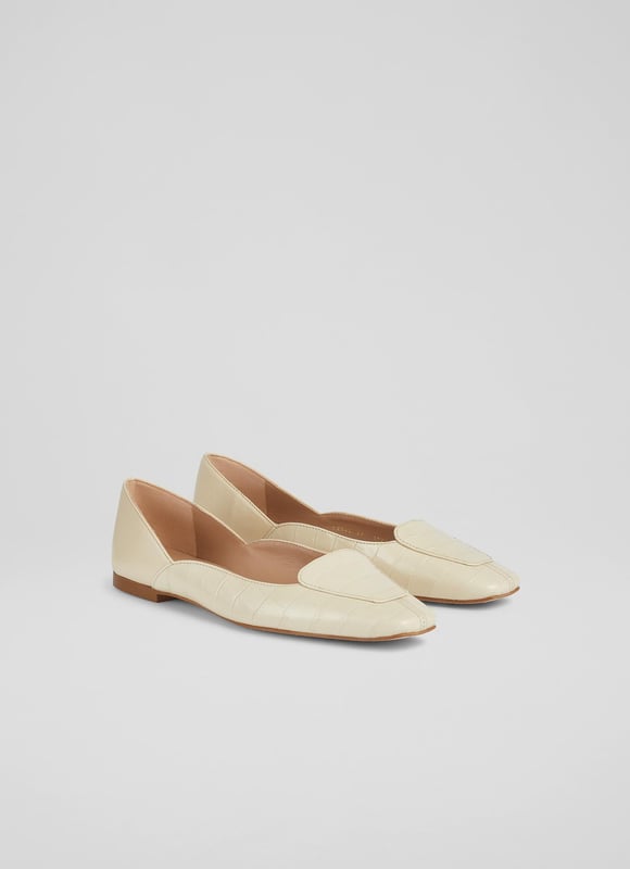 A feminine flat with a loafer feel, our Willow pumps are a stylish hybrid of the two classics. Crafted in Spain from textural croc-effect leather in cream, they have a square toe, loafer styling, a scalloped side cut and a small flat heel. Wear them as an alternative to a ballet pump or loafer on bright spring days.