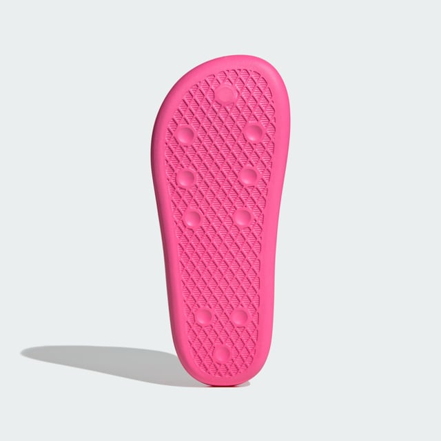 The moment you step into these adidas Adilette Ayoon Slides, you're at ease. That's the whole point of them. They let you bring the comfort of home with you anywhere, thanks to the super soft one-piece EVA foam build. That minimalist approach extends beyond the construction — the colours also keep things toned down, which happens to mean that they also style well with everything.  - Slip-on - EVA upper - Ultra-soft feel - EVA outsole  Shipped by adidas