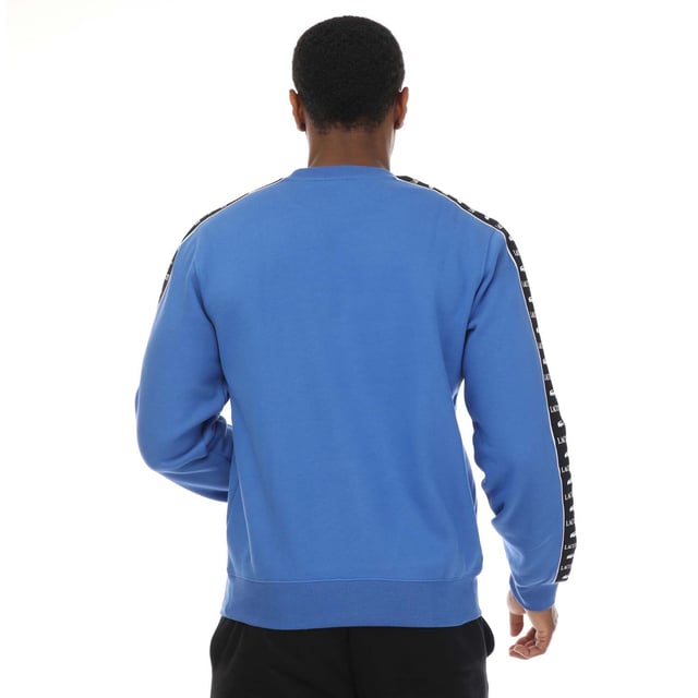 Mens Lacoste Logo Stripe Jogger Sweatshirt in blue.- Ribbed crewneck.- Elasticated cuffs and hem.- Embroidered logo on the chest and a logo pattern down both sleeves.- Classic fit.- Shell Fabric: 80% Cotton  20% Polyester. Rib edge: 98% Cotton  2% Elastane.- Ref: SH749200IXV