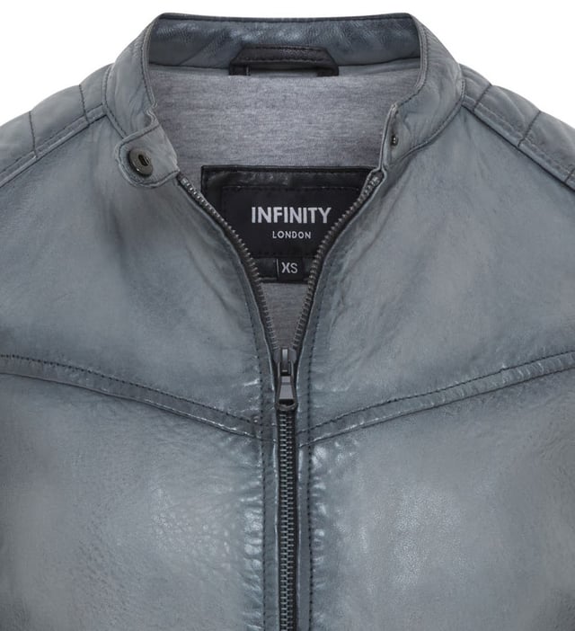 This stylish leather jacket offers a modern take on classic biker style. Crafted from soft lamb leather, it combines comfort and durability with a sleek and edgy aesthetic.

Key Features:

Soft Lamb Leather: Ensures comfort and a luxurious feel.
Modern Biker Style: Features a stand-up collar, zipper closure, and angled pockets.
Functional Pockets: Includes two zippered chest pockets and one interior pocket for secure storage.
Adjustable Waist: The buckle at the hem allows for a customized fit.
Edgy Details: The quilted shoulder panels add a touch of visual interest and enhance the jacket's biker-inspired look, while also providing additional protection.
Quilted Shoulder and Sleeves: The quilted design offer added protection and a stylish touch.
This jacket is perfect for those who want a versatile and stylish piece that can elevate any outfit.