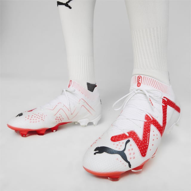 PRODUCT STORY : Calling all playmakers. Inspired by Neymar Jr’s style of play, the new FUTURE ULTIMATE is here so you can Drive Them Crazy. It has a FUZIONFIT360 upper with PWRTAPE support that locks you in for quick cuts and changes of pace. Dynamic Motion System provides more support at the heel, more flexibility at the forefoot, and more traction in every direction. The upper is textured with different levels of grip for dribbling, passing, and finishing, so you can make every play count. FEATURES & BENEFITS : The upper of this shoe is made with at least 20% recycled materials as a step toward a better future. DETAILS : FUZIONFIT360 upper combines engineered dual mesh, stretchy knit and supplemental PWRTAPE support Engineered 3D textures at key contact zones are optimized to enhance ball grip and control for dribbling, passing and finishing Super-lightweight Peba base material guarantees excellent wearing comfort Micro-perforated heel padding keeps the heel locked in and comfortable Lightweight removable sockliner with NanoGrip technology keeps the foot from slipping inside the boot Lightweight Dynamic Motion System outsole enhances traction and agility for unpredictable changes of pace and direction. Suitable for use on both firm natural surfaces and artificial grass (4G) FG/AG: Firm Ground/Artificial Ground Fits regular to wide feet Mid-cut boot.