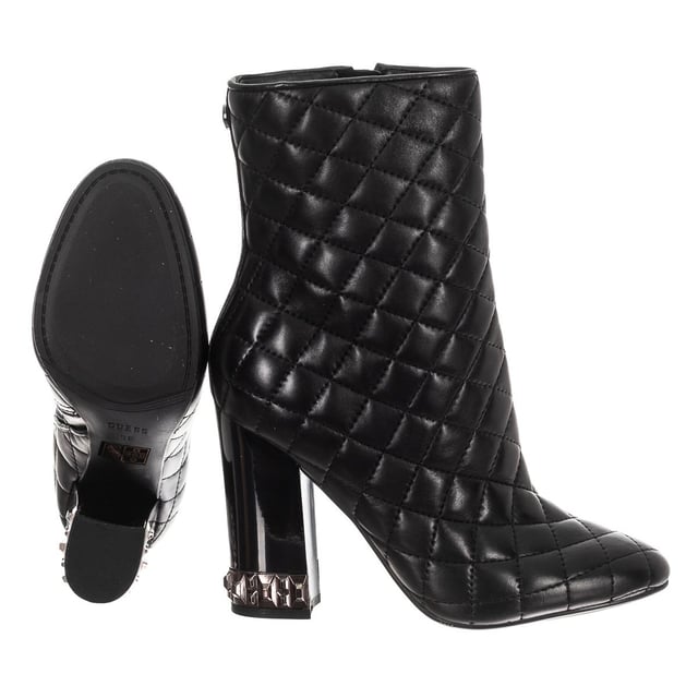 Boots with original design.
 Round toe.
 Quilted finish.
 Metal application of the brand on the back
 Template customized by the brand.
 Rubber sole with non-slip grooves.
 Metallic detail on heel.
 Seams seen in tone.
 Measures: Heel: 10cm
 Composition: Exterior: Leather; Interior: Leather; Sole: Synthetic
 Care:
Hand wash with a damp cloth.