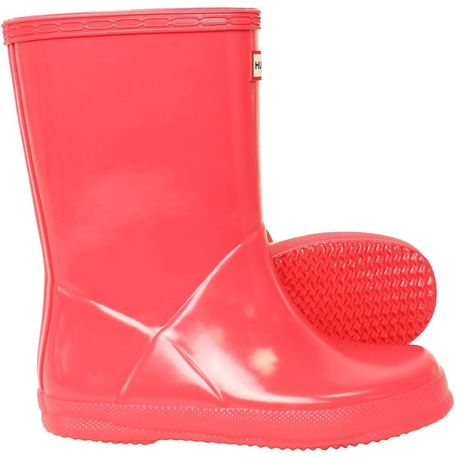 Let your child make a splash in style with the Hunter Gloss Kids Pink Wellington Boots. These boots are a miniature version of the iconic adult style, offering the perfect blend of functionality and fashion. The glossy finish adds a touch of sophistication to the classic design, making them a must-have for every young trendsetter.

Key Features:

 Glossy Finish:  The standout feature of these boots is the glossy exterior, adding a chic and stylish element to the classic Wellington design. The shiny pink hue makes these boots a fun and fashionable choice for rainy days.

 Durable and Waterproof:   Crafted from high-quality rubber, these boots are built to withstand the elements. The waterproof construction ensures that your child's feet stay dry and comfortable, making them suitable for various outdoor activities.

 Comfortable Interior:   Designed for all-day wear, the boots feature a comfortable interior with a cushioned insole. Your child can enjoy extended playtime without sacrificing comfort, making these boots ideal for both casual outings and outdoor adventures.

 Easy to Wear:   The pull-on style and adjustable strap make these boots easy for kids to put on and take off independently. The wide opening and pull tabs enhance convenience, allowing for hassle-free dressing.

 Sturdy Grip:   The slip-resistant sole provides excellent traction on different surfaces, ensuring stability in wet and slippery conditions. These boots are designed to keep your child sure-footed while exploring the outdoors.

 Reflective Logo:   For added safety, the boots feature a reflective Hunter logo. This detail enhances visibility in low-light conditions, making them a practical choice for early morning or evening activities.

 Iconic Branding:   Showcasing the iconic Hunter logo on the front, these boots maintain the brand's reputation for quality and style. The pink color adds a playful touch, making them a versatile and eye-catching accessory.

Elevate your child's rainy-day wardrobe with the Hunter Gloss Kids Pink Wellington Boots â€“ a perfect combination of style, durability, and functionality that brings a pop of color to outdoor play.