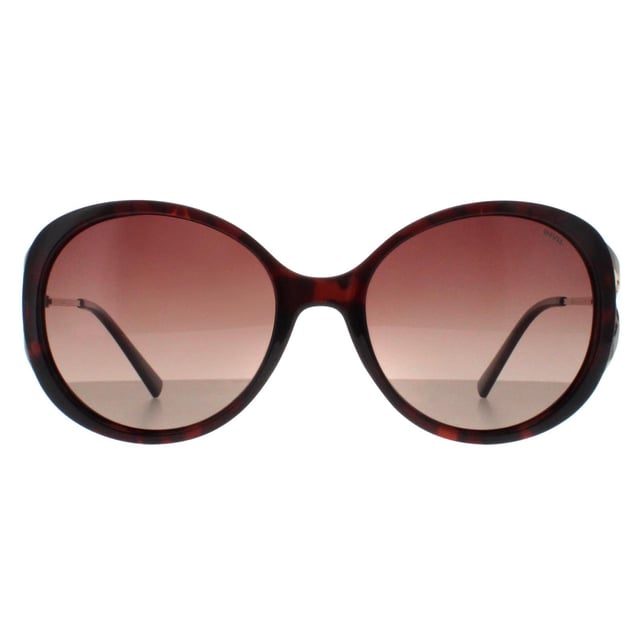 INVU Round Womens Demi Gold Brown Tortoise Brown Polarized B2117  Sunglasses Step into sophistication with the INVU Designer Sunglasses model B2117B, crafted for women who appreciate refined style. These elegant sunglasses feature a round-shaped brown tortoise plastic frame with sleek metal arms, perfectly paired with brown polarized gradient lenses. The B2117B model seamlessly blends vintage charm with modern functionality, offering superior UV protection and exceptional comfort. Available at a fantastic discount from the regular retail price, these premium sunglasses are a must-have accessory for any fashion-forward wardrobe. Elevate your look and indulge in luxury with INVU, all while enjoying unbeatable savings.