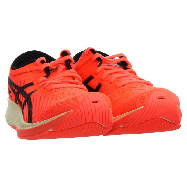 The Asics MetaRacer Tokyo Women's Red Running Trainers are a premium choice for female runners who demand exceptional performance and style. These trainers are designed to offer a competitive edge for racing and high-intensity runs while providing a bold and fashionable look. Here's a detailed description with key features:

 Race-Ready Design:  The MetaRacer Tokyo trainers by Asics are specifically designed for racing and high-performance running. Their lightweight and aerodynamic design aim to enhance speed and efficiency.

 Top-Quality Materials:  Asics is known for using high-quality materials in their footwear. These trainers are typically constructed from top-tier materials, ensuring durability, support, and comfort.

 Vibrant Red Color:  The trainers come in a vibrant red color with eye-catching accents, providing a bold and dynamic look that stands out during races and training sessions.

 Responsive Cushioning:  These trainers feature a responsive midsole that offers excellent energy return, ensuring that each stride propels you forward with maximum efficiency.

 Carbon Plate Technology:  The MetaRacer Tokyo trainers often incorporate a carbon plate in the midsole, which enhances stability and helps maintain a consistent stride during races.

 Secure Lace Closure:  The trainers typically feature a lace-up closure system that ensures a secure and customizable fit tailored to your foot shape.

 Minimalist Upper:  The upper of the shoes is designed to be lightweight and breathable, promoting airflow and reducing weight to keep you cool and comfortable during intense runs.

 Durable Outsole:  The outsole is designed to provide excellent traction and durability, ensuring grip and stability during races on various surfaces.

 Asics Branding:  You can expect to find Asics branding elements, such as the Asics logo or label, integrated into the trainers' design, reflecting the brand's commitment to quality and performance.

The Asics MetaRacer Tokyo Women's Red Running Trainers are the ultimate choice for female runners who are serious about achieving their best performance. Their striking red color and advanced features make them a standout option for those who want to make a statement on the track or during high-intensity runs.