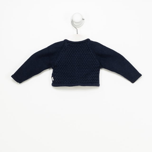 Tricot knit jacket.
 Round neck.
 Button closure on the front.
 Embroidered details on the front.
 Composition: 75% Cotton, 20% Polyamide, 5% Wool
 Care:
- Wash maximum at 30ºC.
 - Iron at medium temperature, max. 110ºC.
 - It is not allowed to use a dryer.
 - Do not use bleach.
 - Does not support dry cleaning.