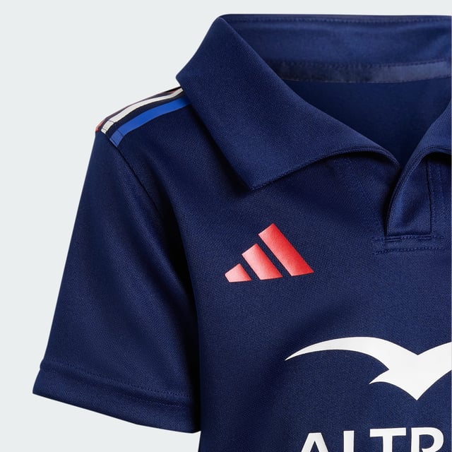 Now they can root for their favourite rugby team in adidas style. This kids' France home kit lets them feel like they're part of the action. Moisture-managing AEROREADY keeps them comfortable and dry whether they're kicking a ball around or cheering from the sidelines. A team crest and tricolour 3-Stripes complete a look that will inspire a lifetime of support.This product is made with 100% recycled materials. By reusing materials that have already been created, adidas help to reduce waste and our reliance on finite resources and reduce the footprint of the products adidas make.  - Regular fit - 100% polyester (recycled) - AEROREADY - Shorts: Elastic waist - France crest  Shipped by adidas