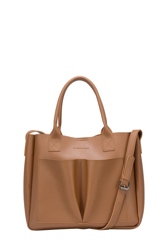 Be anything but basic with this classic wardrobe staple. The Megan XL Tote is the perfect accessory for making a statement and is highly functional too. Inside is a spacious compartment, big enough to carry the days essentials. You can also find a pouch which can be removed, ideal for storing items you want to keep extra secure, or use it as a mobile makeup bag! You have a choice of styling with the tote grab handles and the adjustable shoulder strap, so you can change your look depending on your chosen style! Features: , Lightly textured PU exterior, Claudia Canova debossed logo, Magnetic clasp fastening, Two exterior slip pockets, 2 x tote grab handles, Adjustable shoulder strap, Interior pouch which can be removed using the snap button clasps, Pouch measurement: W 304 x H 203 x D 63 mm, Zip top fastening on interior pouch Style Ref: 84607 TAN