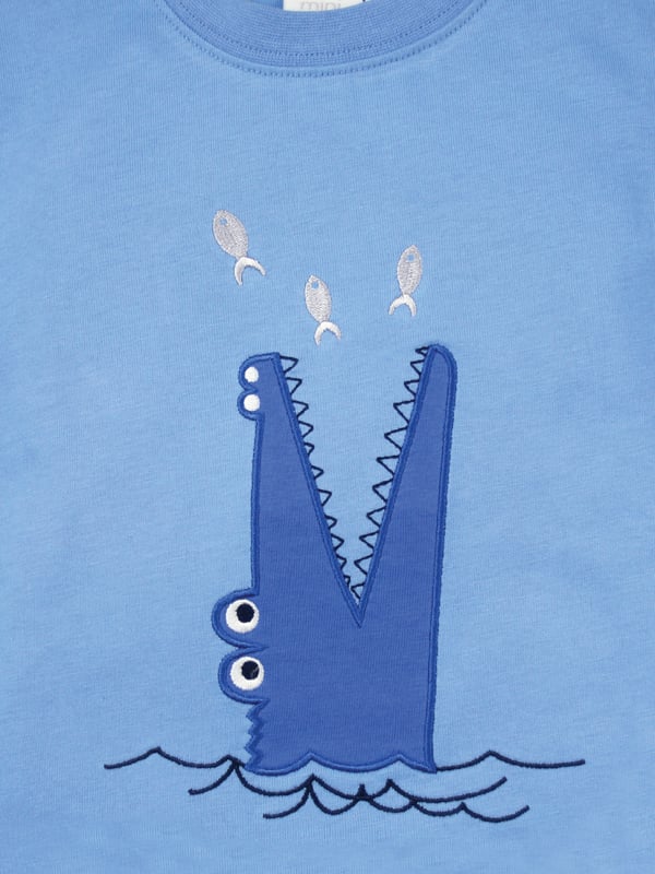 Our crocodile is guaranteed not to bite  - it only snaps!! Our shortie cotton pyjamas set brings some fun to bedtimes!

Made from 100% super soft cotton. The soft jersey mid blue top, with the a Snappy Crocodile embroidery applique has a matching rib neck, so easy to put on and off. The shorts have a fully soft elasticated waist and are made in a crisp summer cotton woven blue check.  We are sure these will be a firm favourite this summer!

Sold as a Pyjama set
Smiley Crocodile Applique
Fabric: 100% cotton
Fire Warning : KEEP AWAY FROM FIRE AND FLAMES.
Wash Care Instructions : Machine wash inside out, do not soak, wash dark colours separately. Do not iron trims or motifs. Save energy and wash at 30 degrees.
Do not tumble dry