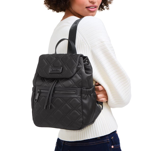 This Carvela Taylor Midi Backpack is a black nylon style with overstitch diamond design. The front flap has a branded plate and there is a zipped pocket on the front. Dimensions: 29cm (H),  24cm (L), 10cm (D). Strap length: 99cm.