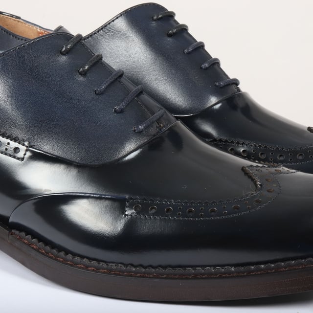 Make a bold impression with the Justin Reess Harry Men's Patent Leather Brogue Shoes in striking green. Crafted from vibrant green patent leather, these shoes are designed to stand out and elevate your formal attire. Featuring a classic brogue design with intricate perforations and decorative stitching, they embody elegance and sophistication for any occasion. The secure lace-up closure allows for a customizable fit, ensuring comfort throughout the day. Built with high-quality materials and expert craftsmanship, these shoes offer durability and longevity, making them a stylish addition to your wardrobe.

Striking Green Patent Leather for a bold statement
Classic Brogue Design with elegant perforations
Lace-Up Closure for a secure, adjustable fit
Durable Construction for long-lasting wear